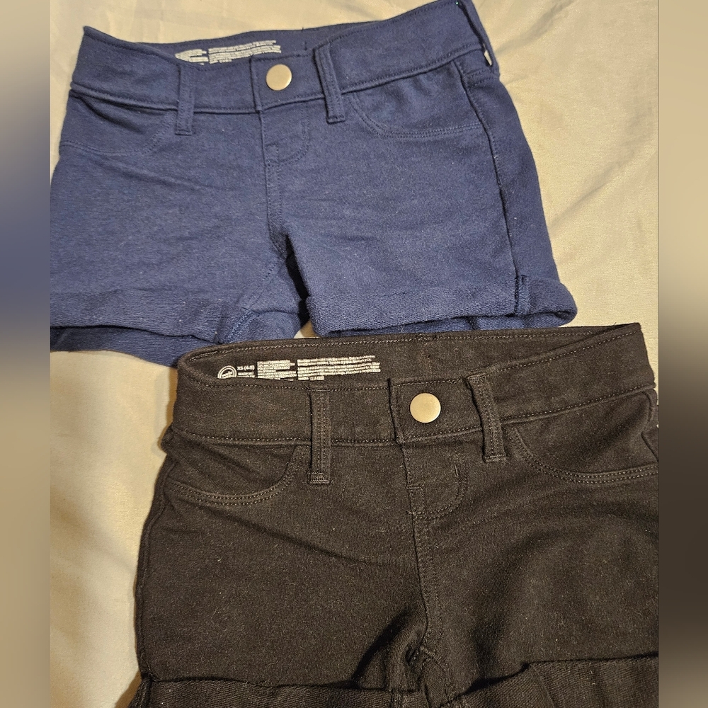 Girls Bundle of shorts blue and black both size xs (4-5). Good condition.